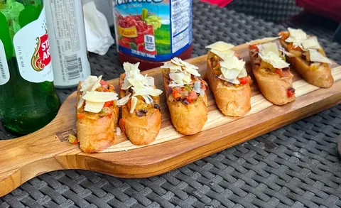 Bruschetta bites on a wooden board
